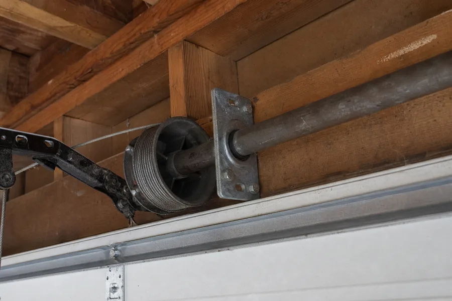 End bearing plate and cable drum above a garage door in Tulsa, OK